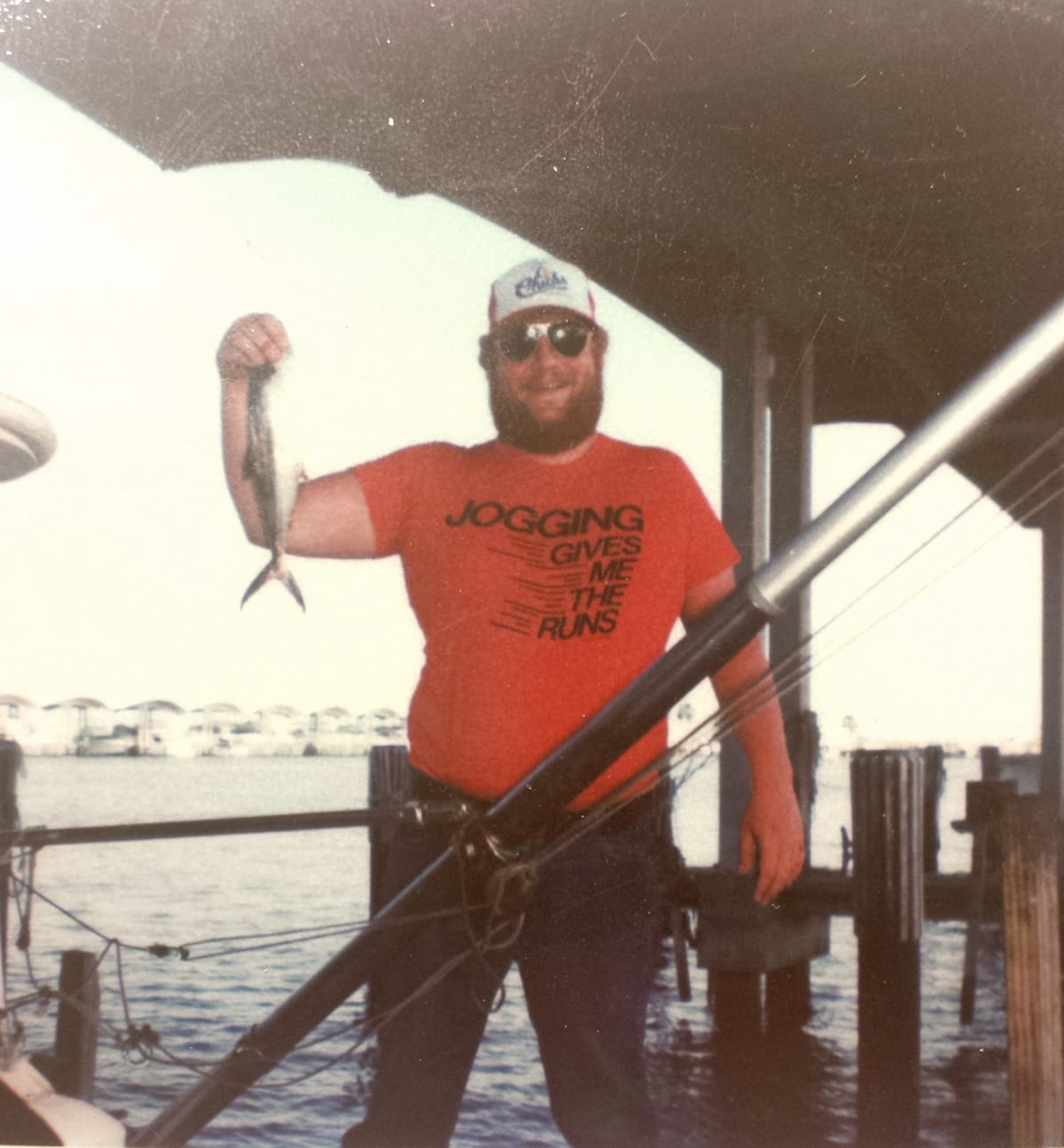 Jim Quessenberry posing for a photo at a BBQ competition.